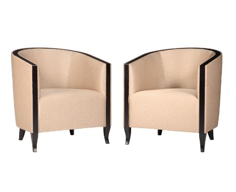 A PAIR OF EBONISED AND BEIGE UPHOLSTERED TUB ARMCHAIRSIN ART DECO TASTERECENTLY MANUFACTURED BY THE SOFA AND CHAIR COMPANY, L