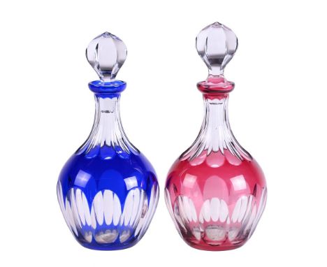 BACCARAT, TWO SIMILAR CLEAR AND COLOURED FLASHED GLASS CLUB SHAPED DECANTERS AND STOPPERSEach with etched marks30 and 29cm hi