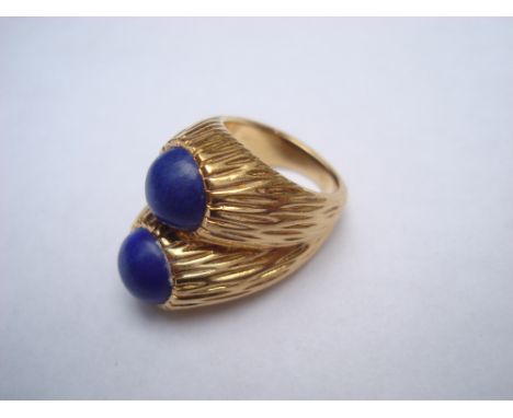 A yellow metal double ring set with lapis lazuli, the inside shank marked Cartier, Ca. 1970, size R (rubbed marks to exterior