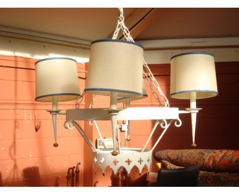 A white painted five light chandelier with shades. 