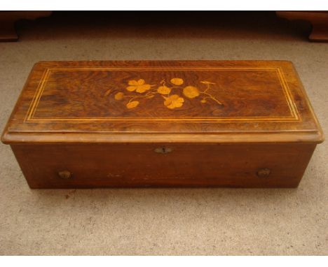 A 19th Century Continental musical box with 10 1/2 inch drum and comb playing eight airs. 