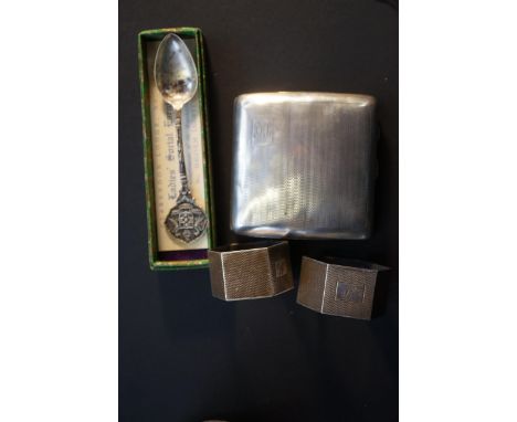 Silver cigarette case, silver masons spoon &amp; pair of silver napkin rings (Bruising to case) Weight 123g