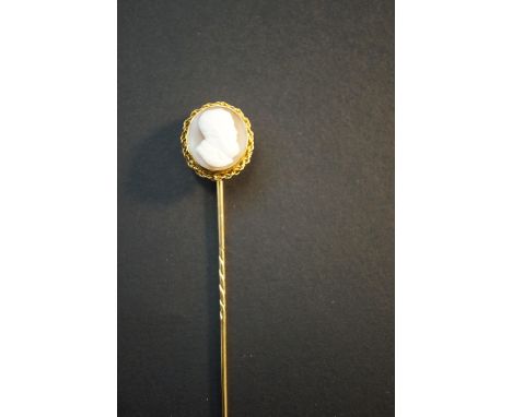 Unmarked yellow metal stick pin with cameo