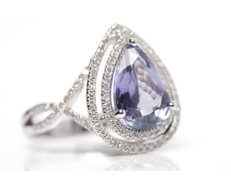 TANZANITE AND DIAMOND RINGthe pear shaped tanzanite of approximately 3.65 carats in a diamond setting, on diamond shoulders, 