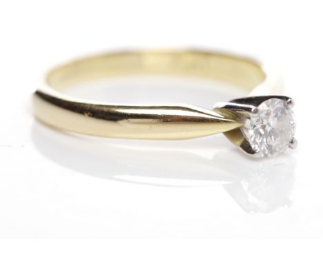 DIAMOND SOLITAIRE RINGthe brilliant cut stone of approximately 0.31 carats in eighteen carat gold, size L-M