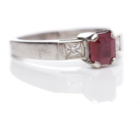 RUBY AND DIAMOND THREE STONE RINGthe central emerald cut ruby 5.7 x 5mm flanked by two countersunk princess cut diamonds, in 