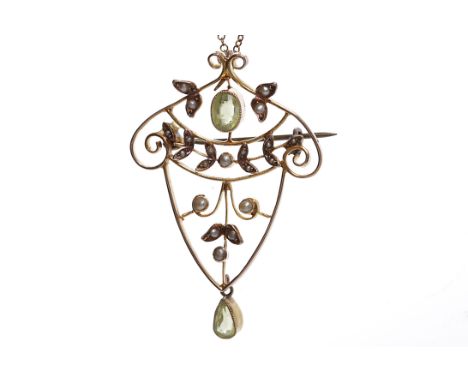EDWARDIAN PERIDOT AND SEED PEARL BROOCH/PENDANTof openwork form, set with an oval peridot above a pear cut peridot drop, the 