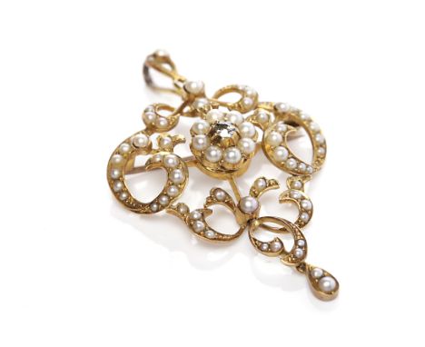 EARLY TWENTIETH CENTURY PEARL AND DIAMOND SET BROOCH/PENDANTof sinuous openwork form, with split pearls and a single diamond,