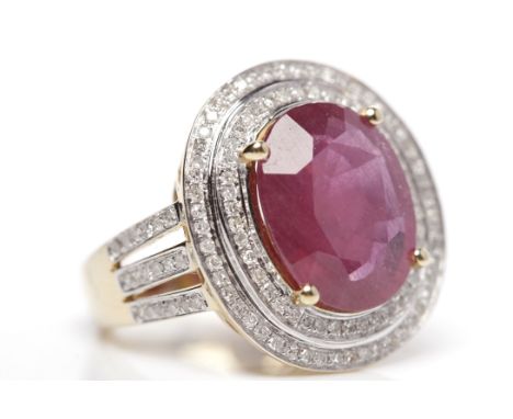 IMPRESSIVE RUBY AND DIAMOND RINGset with a central oval ruby of approximately 7.00 carats, in a diamond setting, on diamond s