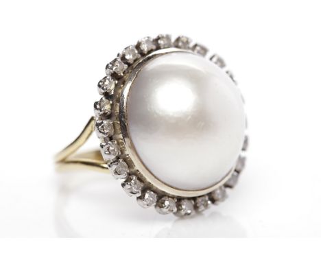 IMPRESSIVE MABE PEARL AND DIAMOND RINGthe central mabe pearl 16.7mm across, surrounded by diamonds, unmarked, with sizing sph