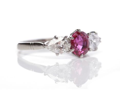 RUBY AND DIAMOND THREE STONE RINGthe central oval ruby of approximately 1.30 carats, flanked by a pear shaped diamond to each