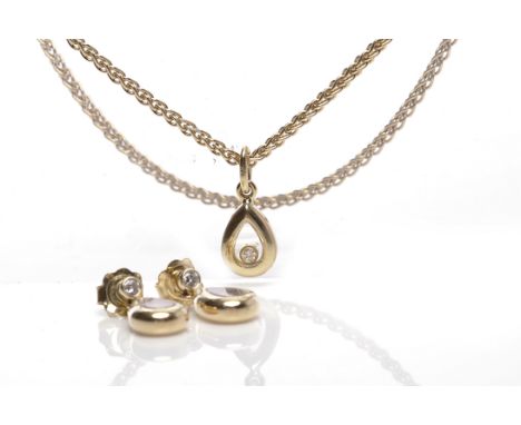 CHOPARD HAPPY DIAMONDS PENDANT ON CHAIN WITH MATCHING EARRINGSthe pendant of pear shape and set with a single free-moving rou