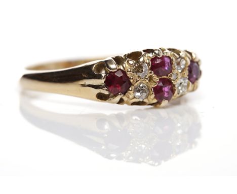 VICTORIAN RUBY AND DIAMOND RINGset with round rubies and old cut diamonds, in eighteen carat old, with full Birmingham hallma