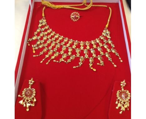 HIGH CARAT GOLD WEDDING JEWELLERY SETcomprising a necklace, a pair of earrings and ring, the necklace set with turquoise, rub