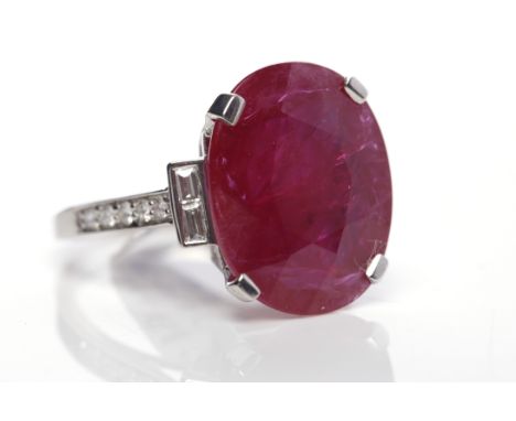 IMPRESSIVE RUBY AND DIAMOND RINGthe central oval ruby of approximately 10.00 carats with two baguette cut diamonds to each si