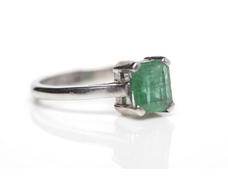 EMERALD DRESS RINGthe central emerald cut stone approximately 1.20 carats, in eighteen carat white gold, size M