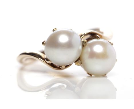 PEARL DRESS RINGset with two spherical pearls approximately 6.5mm diameter, in twist setting, unmarked, size H