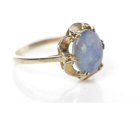 OPAL TRIPLET DRESS RINGwith a central oval opal triplet, hallmarked for nine carat gold, size M-N