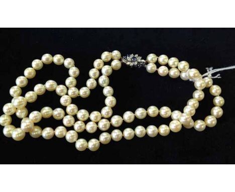 TWO ROW PEARL NECKLACE formed by spherical pearls, each approximately 8.4mm diameter, with a diamond and sapphire set clasp 2
