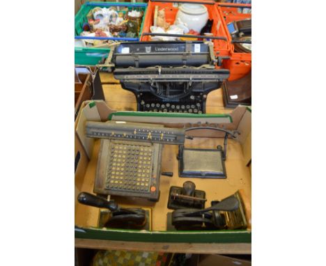 An early Underwood typewriter and other office equipment.