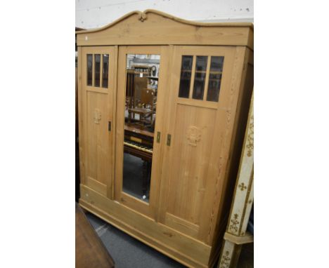 A French pine three door wardrobe.