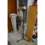 An ornate brass floor standing oil lamp.