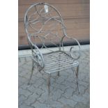 A good naturalistic style wrought metal garden armchair.