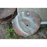 A large circular saw blade.
