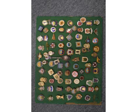A good collection of enamel badges, framed and glazed.