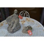 Two reconstituted stone garden ornaments.