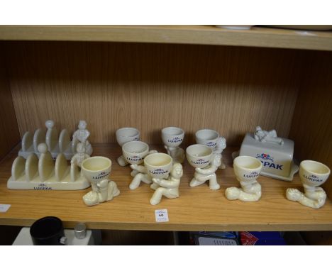 A collection of Lurpak pottery items to include egg cups, toast racks and butter dish complete with original boxes.