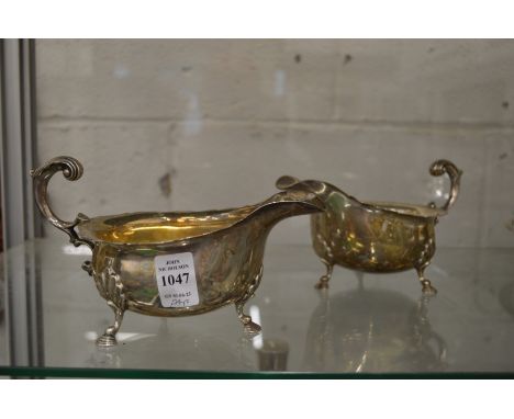 A good pair of large silver sauce boats on hoof feet.