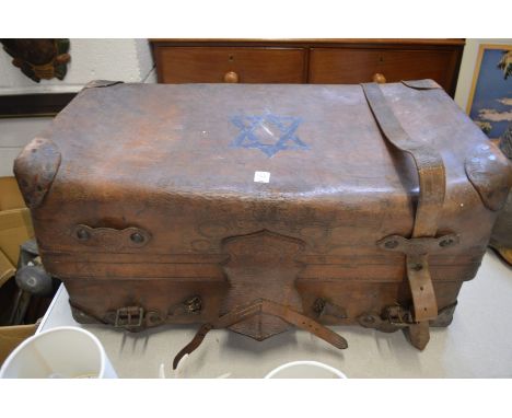 A large leather travelling trunk.