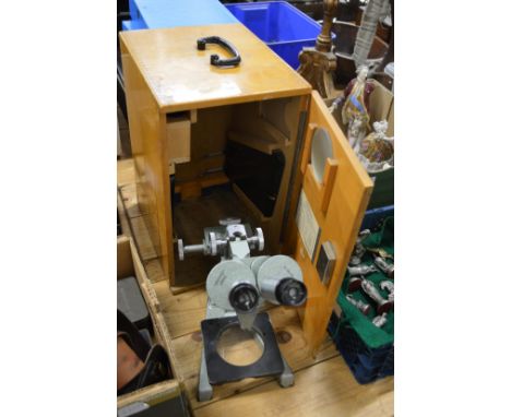 A microscope with travelling case.