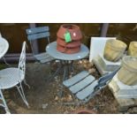 A grey painted metal bistro set comprising table and pair of folding chairs.