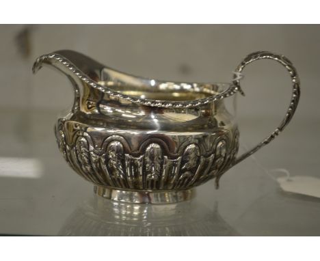 A silver cream jug.