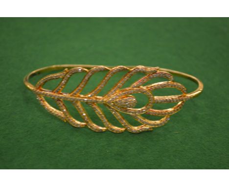 A decorative leaf shaped bangle.