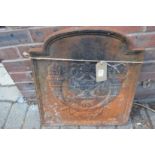 A small cast iron fireback.