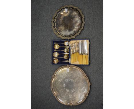 Two silver plated salvers, cased set of six fruit spoons and six fish knives and forks.