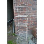 A wrought iron five tier plant stand.