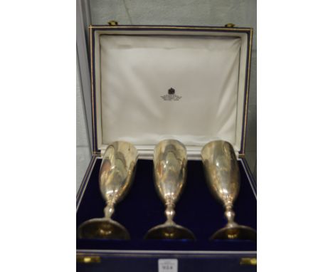 A cased set of Asprey &amp; Co silver wine goblets, engraved with initials.