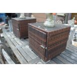 A pair of garden storage cubes with glass tops.
