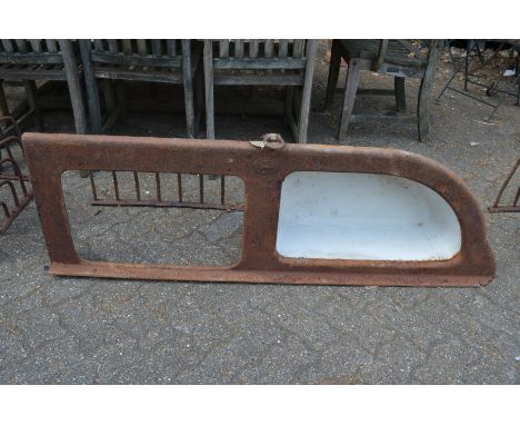 An unusual cast iron and enamel combination hay manger and water trough.