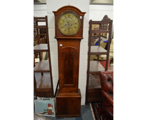 A 19th century mahogany longcase clock with circular brass dial.