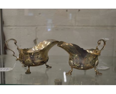 A good pair of silver sauce boats on shell cast feet.