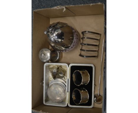 Silver pepper grinder, toast rack and other items.