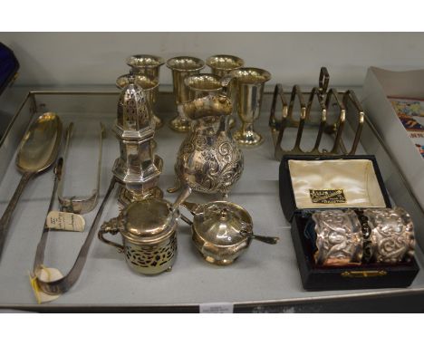A collection of mixed silver items to include pedestal cups, pair of cased napkin rings, cream jug etc.