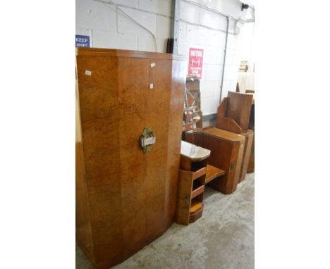 An Art Deco bedroom suite comprising two door wardrobe, pedestal dressing table with stool and bedframe with pair of intergra