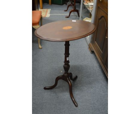 An inlaid mahogany tripod table.