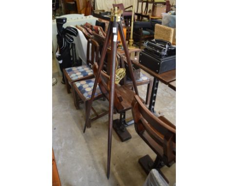 A tripod floor lamp.